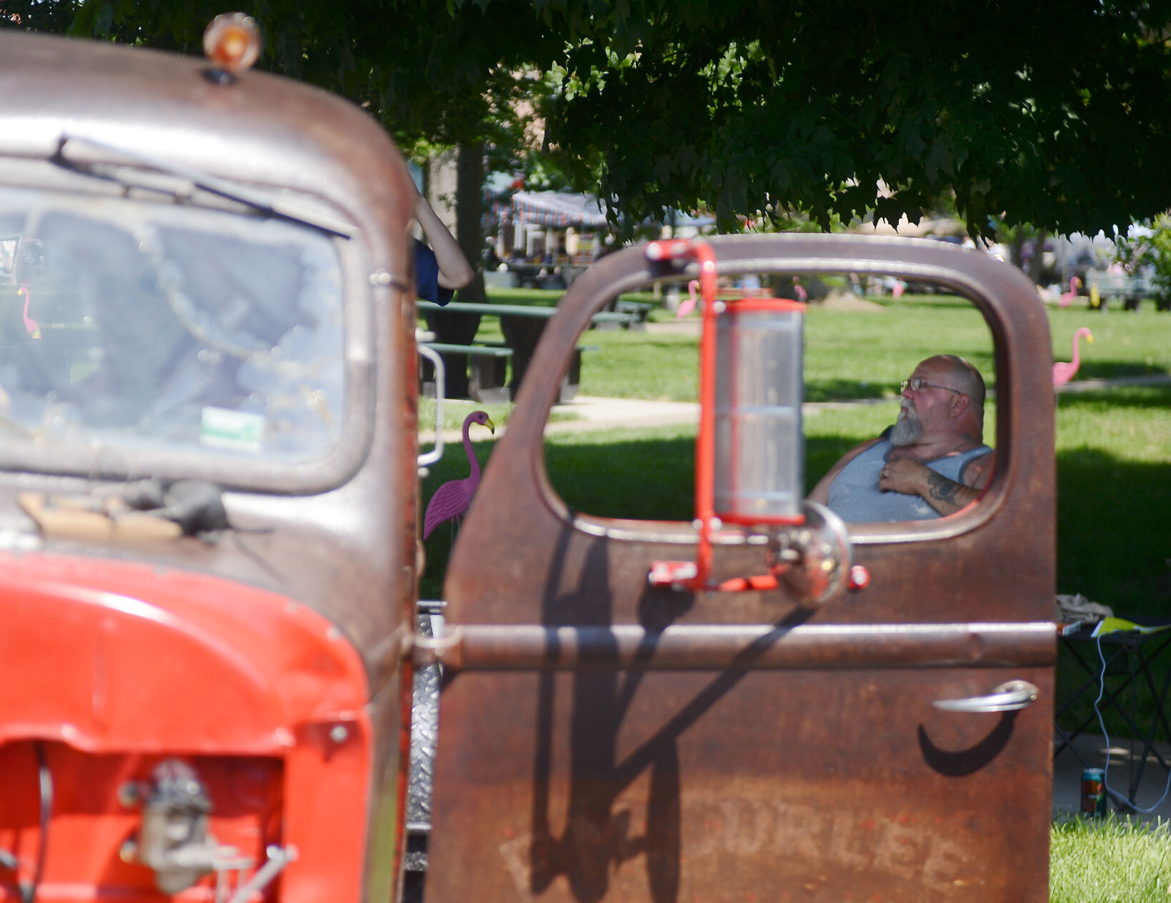 Dennis Zumsteg sits by his Rat Rod
